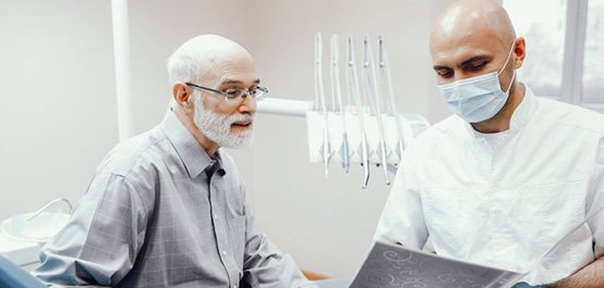 a patient undergoing a dental implant consultation