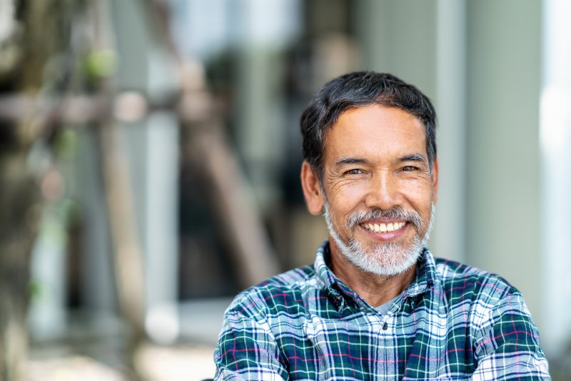 Man smiling outside